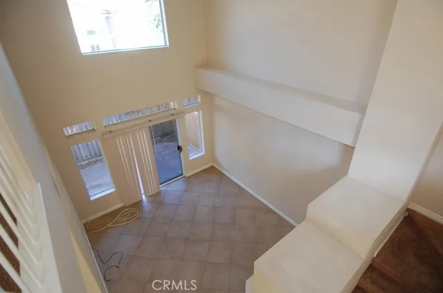 a view of entryway with stairs and wooden floor