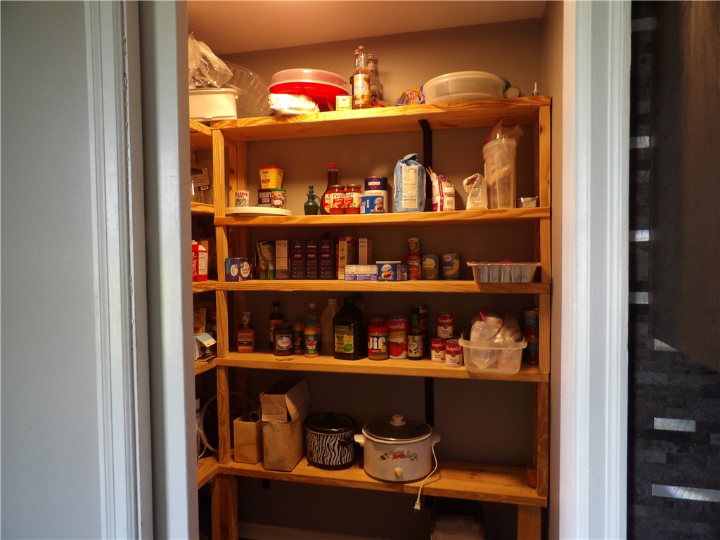 4505 North Alcony Conover Road Conover, OH 45317 - Photo 62 of 64 Organized shelving provides abundant storage for culinary essentials.