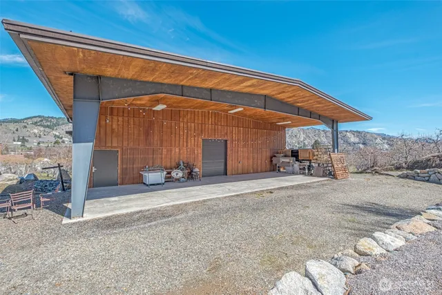 a bathroom with a tub and a view of living room