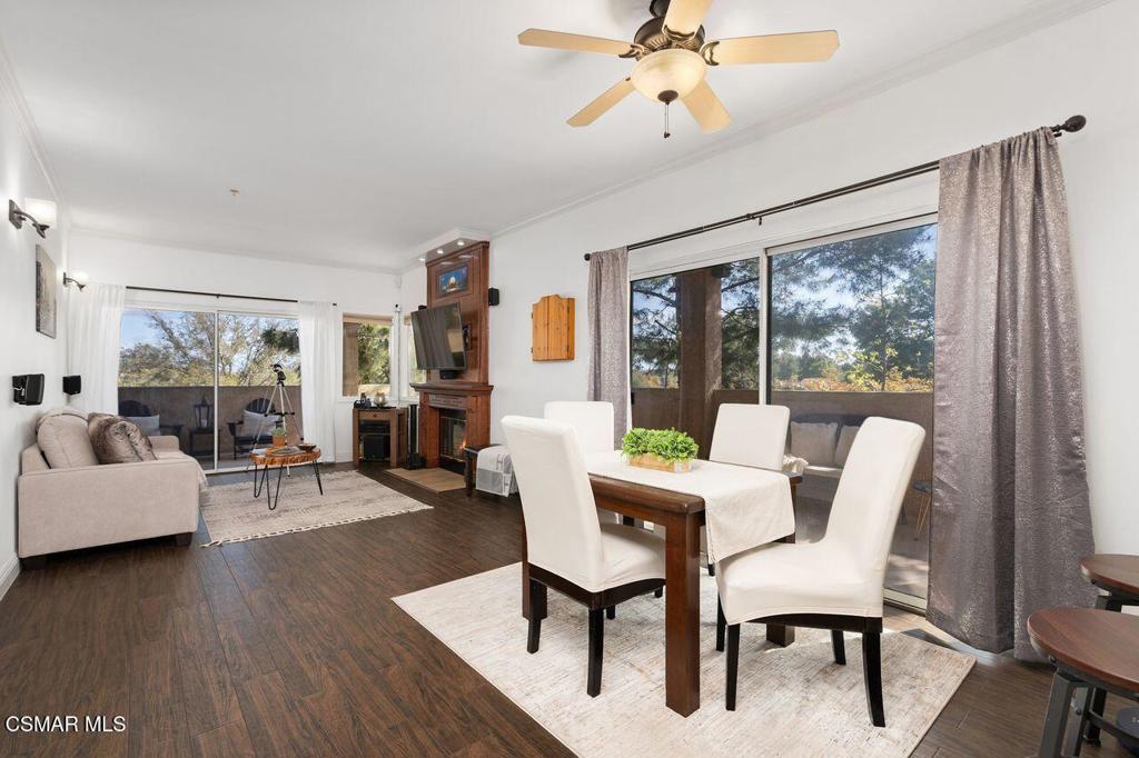 a view of a livingroom with furniture window and wooden floor