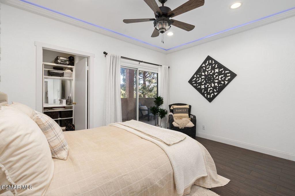 2716 Borchard Road Newbury Park, CA 91320 - Photo 13 of 30 a bedroom with a bed and a chandelier