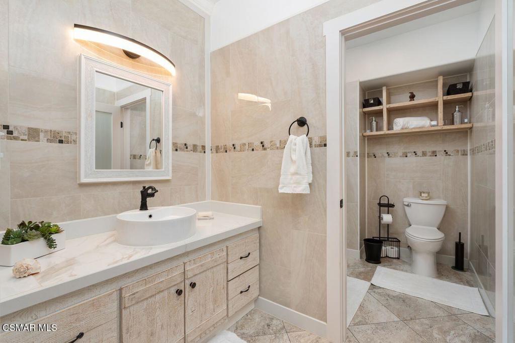 2716 Borchard Road Newbury Park, CA 91320 - Photo 14 of 30 a bathroom with a sink a toilet and a mirror