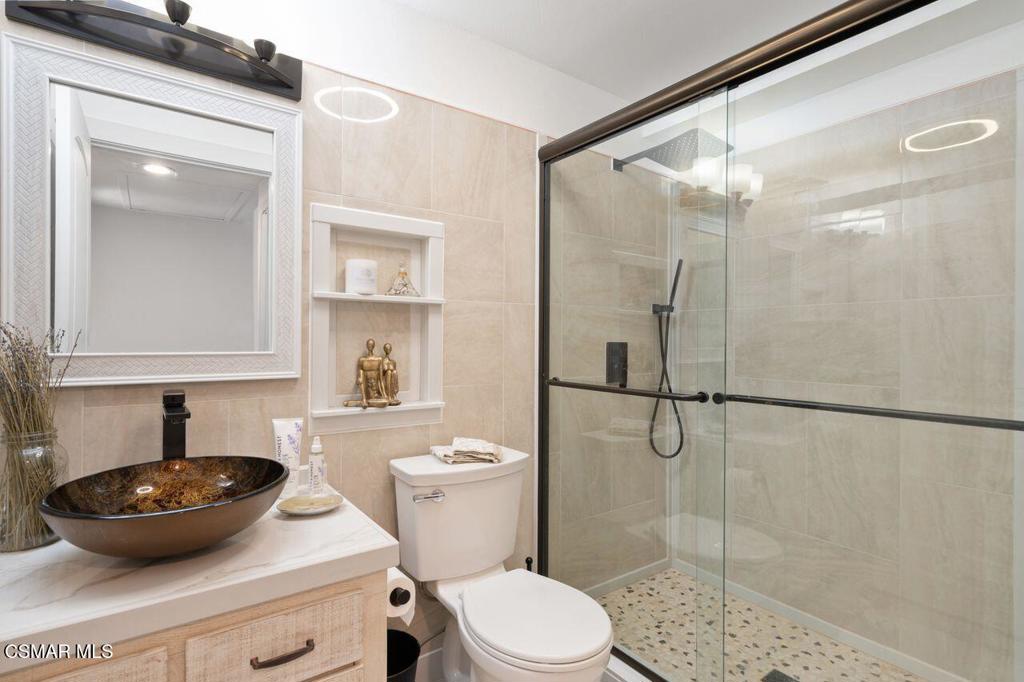 2716 Borchard Road Newbury Park, CA 91320 - Photo 18 of 30 a bathroom with a toilet a sink and a shower