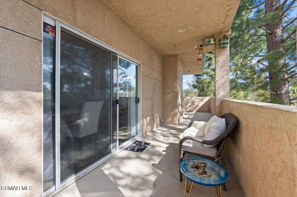 2716 Borchard Road Newbury Park, CA 91320 - Photo 20 of 30 a living room with furniture and a floor to ceiling window