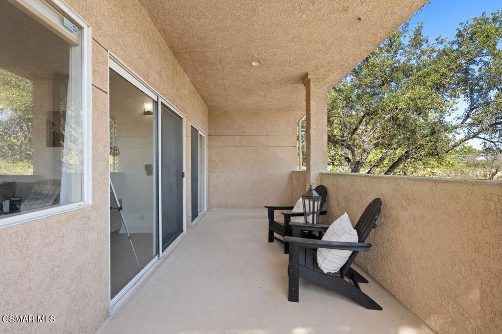 2716 Borchard Road Newbury Park, CA 91320 - Photo 22 of 30 a balcony with couple of chairs and a potted plant