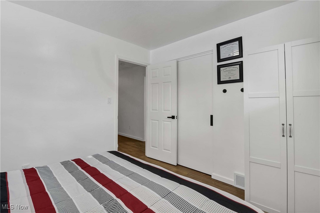9999 Reichert Road Parma, OH 44130 - Photo 20 of 44 Unfurnished bedroom with wood finished floors and a closet