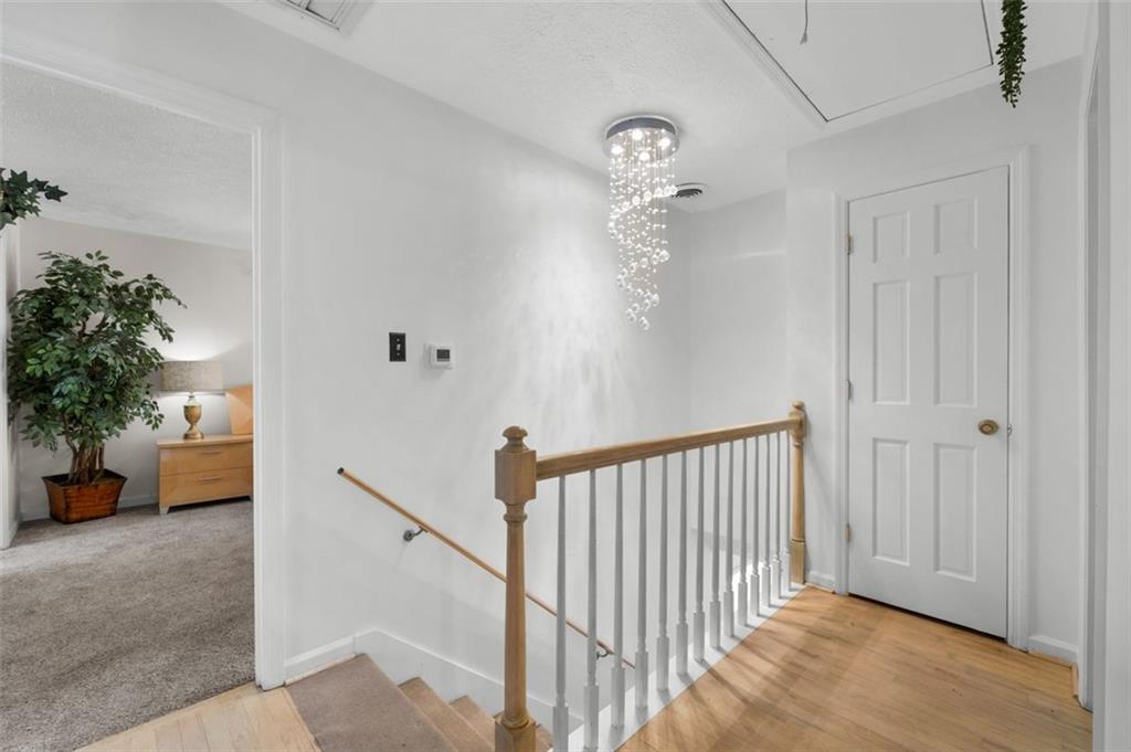 58 Cedar Bluff Winder, GA 30680 - Photo 13 of 39 a view of a hallway to room with wooden floor