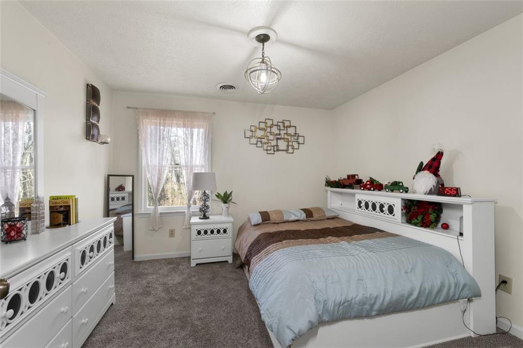 58 Cedar Bluff Winder, GA 30680 - Photo 15 of 39 a bedroom with a bed and a large window