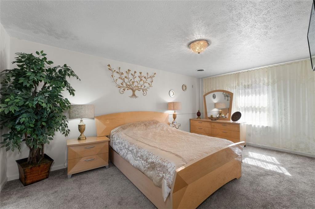 58 Cedar Bluff Winder, GA 30680 - Photo 16 of 39 a bedroom with a bed and a painting on the wall