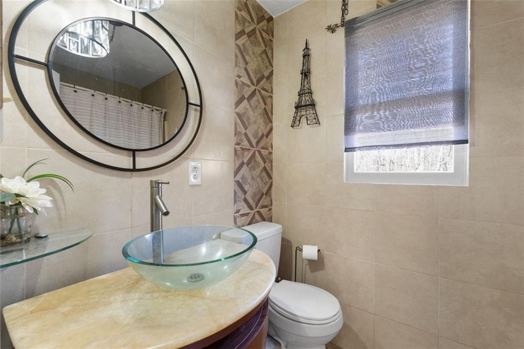 58 Cedar Bluff Winder, GA 30680 - Photo 17 of 39 a bathroom with a toilet a sink and a mirror