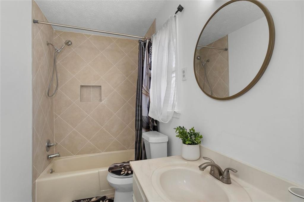 58 Cedar Bluff Winder, GA 30680 - Photo 30 of 39 a bathroom with a sink a toilet and a mirror