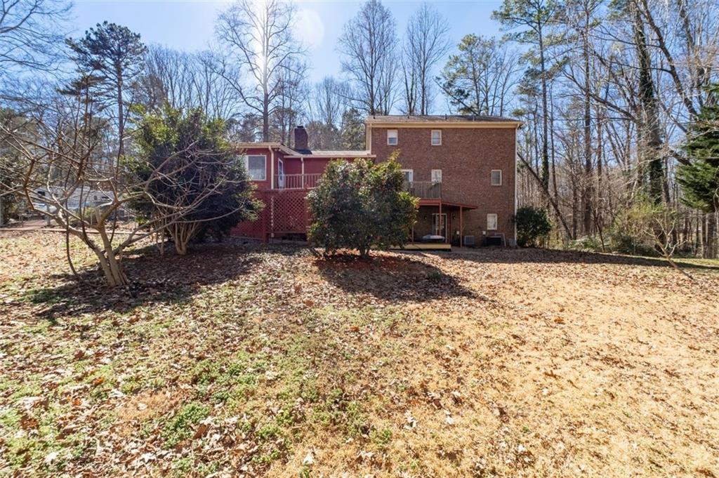 58 Cedar Bluff Winder, GA 30680 - Photo 38 of 39 a brick building with a tree in front of it