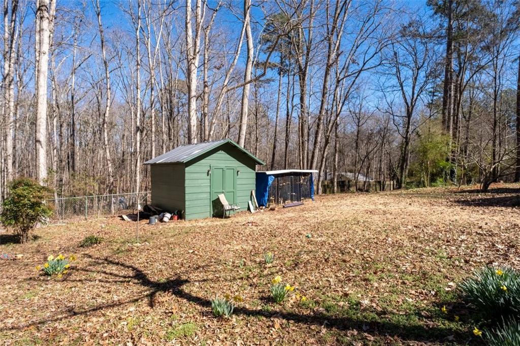 58 Cedar Bluff Winder, GA 30680 - Photo 39 of 39 a yellow house with trees in front of it