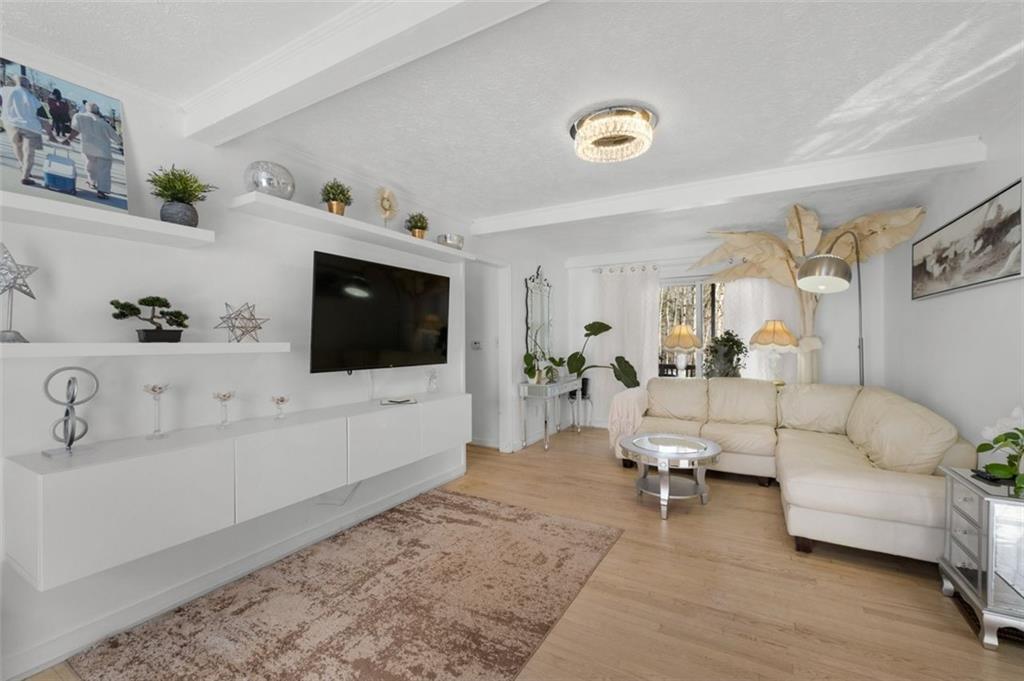 58 Cedar Bluff Winder, GA 30680 - Photo 4 of 39 a living room with furniture and a flat screen tv