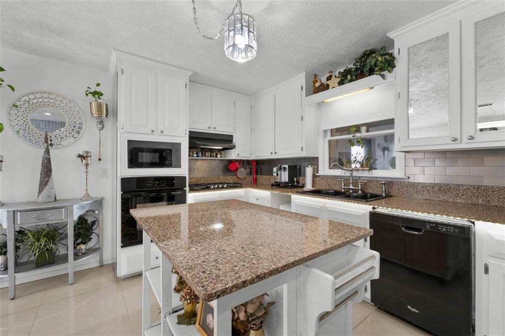 58 Cedar Bluff Winder, GA 30680 - Photo 6 of 39 a kitchen with sink cabinets and microwave