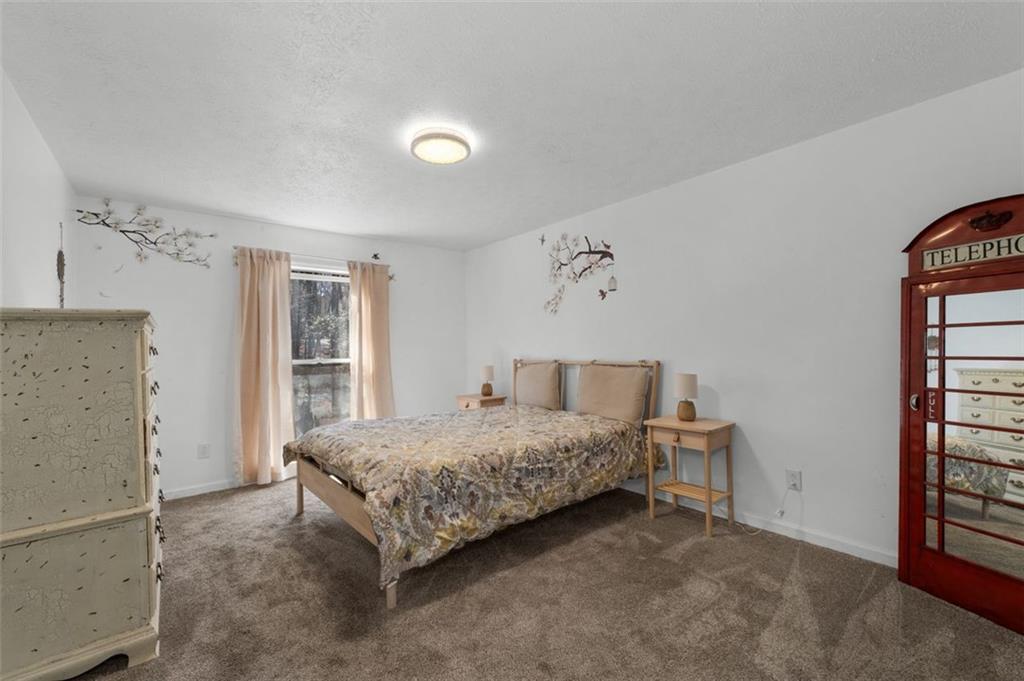 58 Cedar Bluff Winder, GA 30680 - Photo 10 of 39 a bedroom with a bed and a window