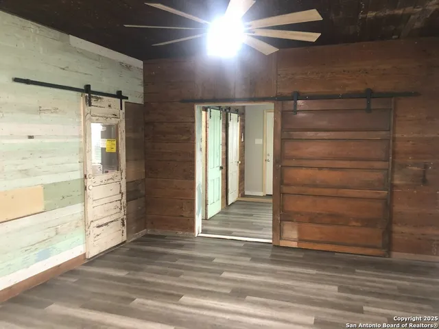 a view of an entryway door and hallway