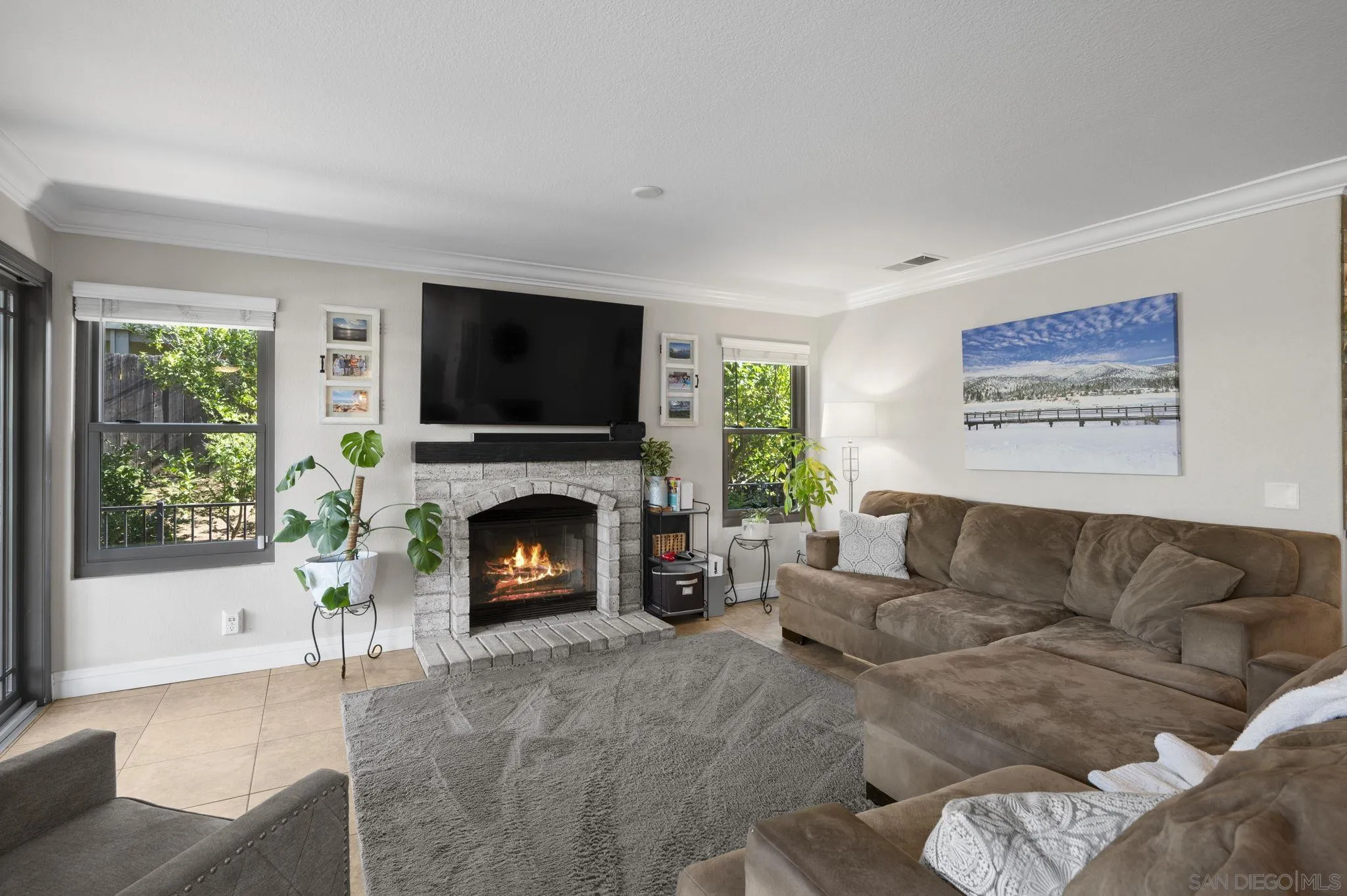 13972 Poway Valley Road Poway, CA 92064 - Photo 11 of 59 a living room with furniture a flat screen tv and a fireplace