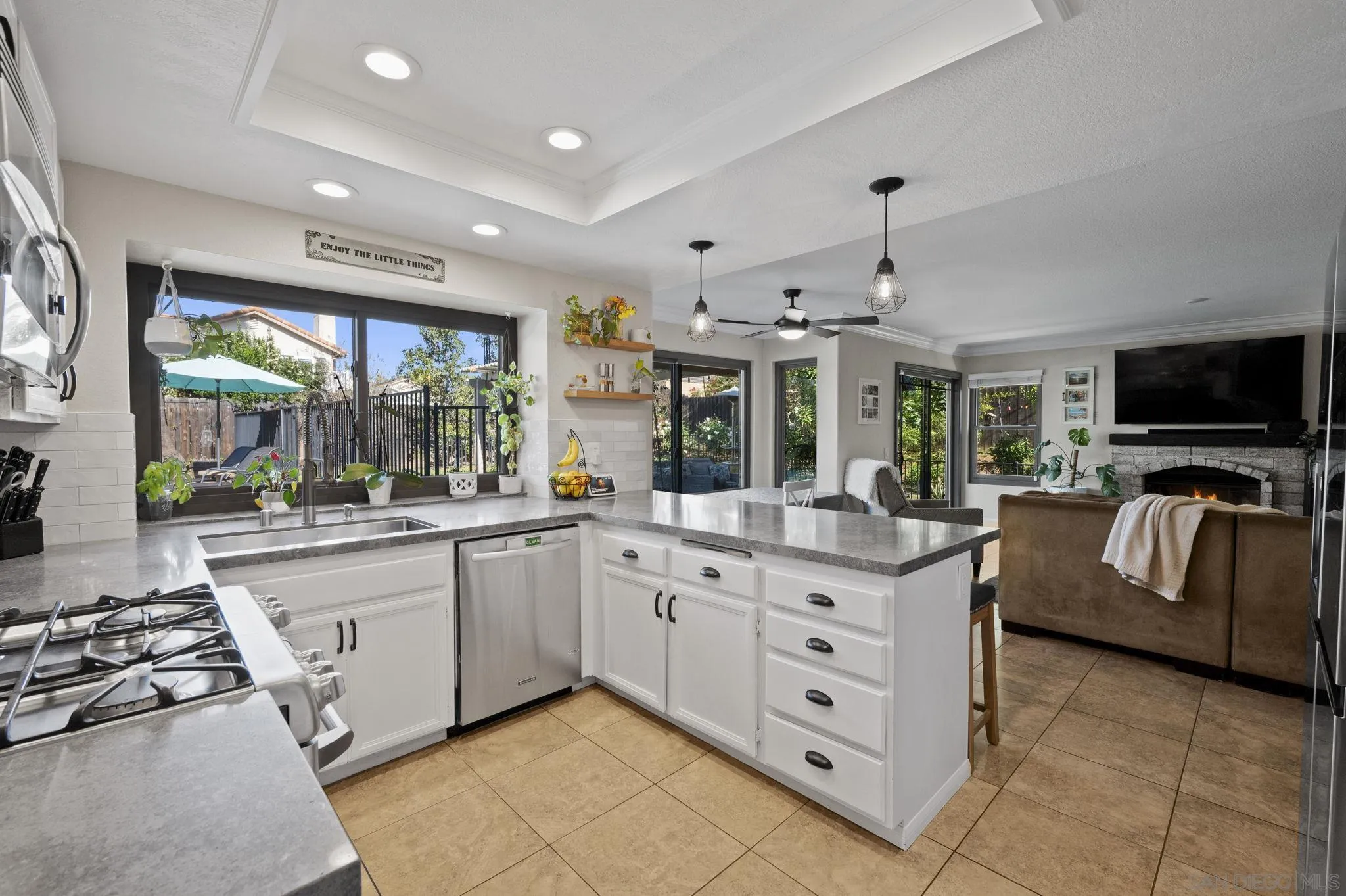13972 Poway Valley Road Poway, CA 92064 - Photo 16 of 59 a large white kitchen with stainless steel appliances granite countertop a stove and a sink