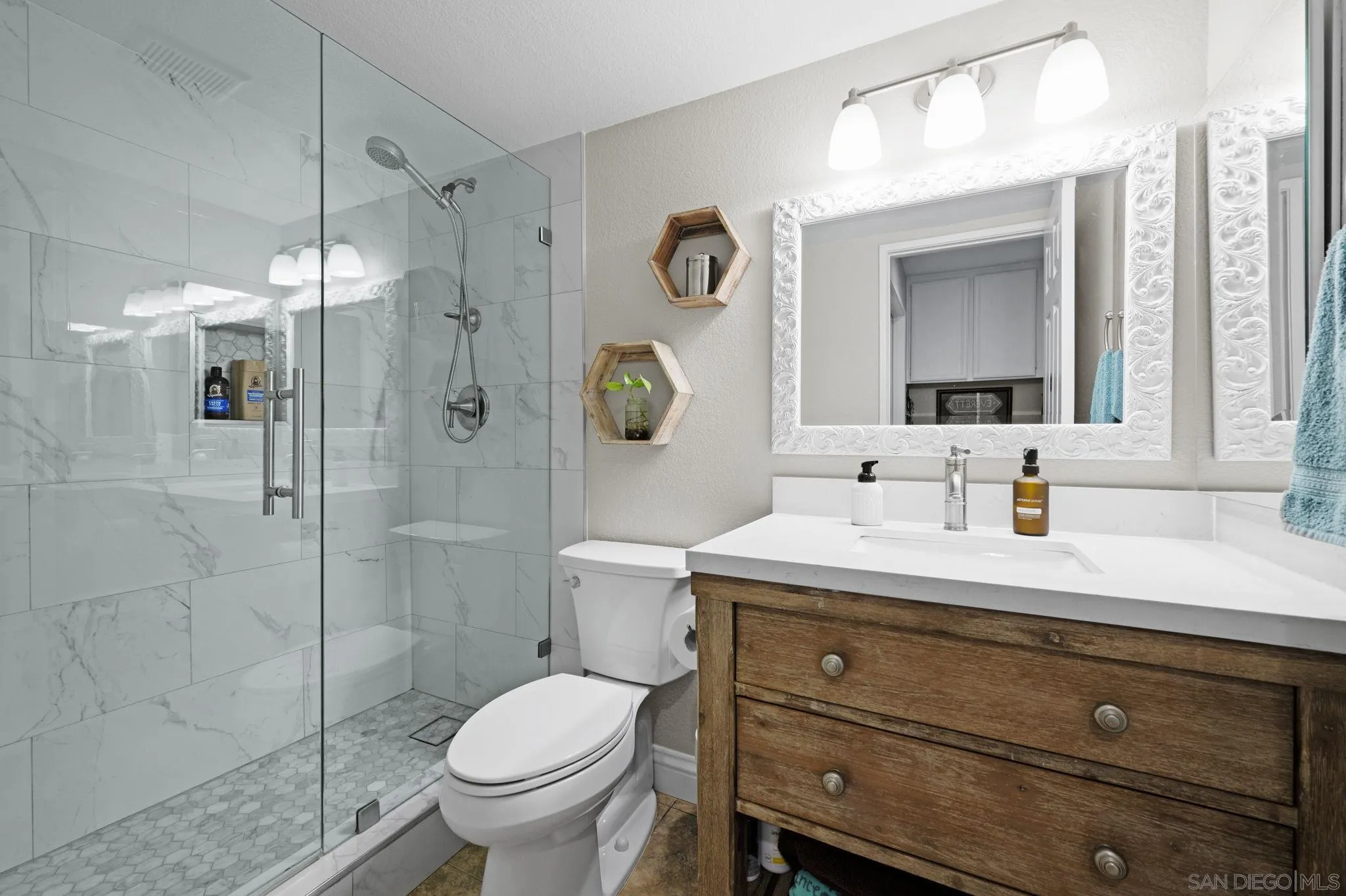 13972 Poway Valley Road Poway, CA 92064 - Photo 17 of 59 a bathroom with a granite countertop toilet sink and mirror