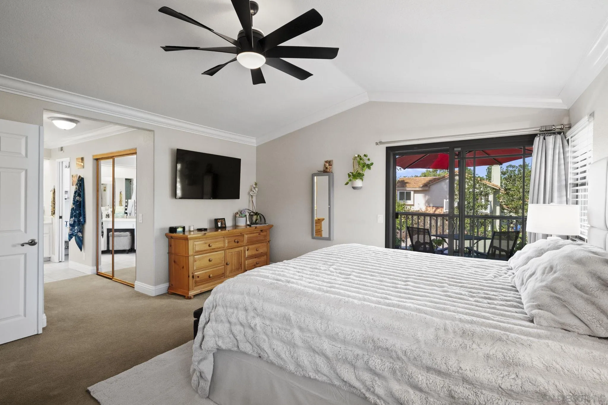 13972 Poway Valley Road Poway, CA 92064 - Photo 24 of 59 a bedroom with a balcony a bed and a flat screen tv