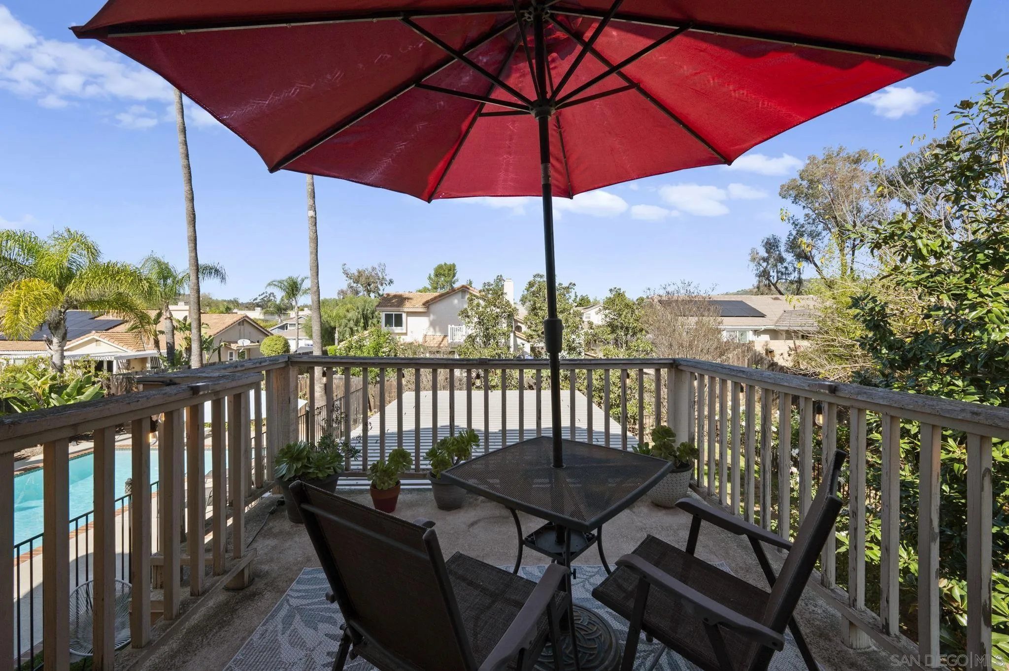 13972 Poway Valley Road Poway, CA 92064 - Photo 27 of 59 a view of a balcony with wooden floor and outdoor seating