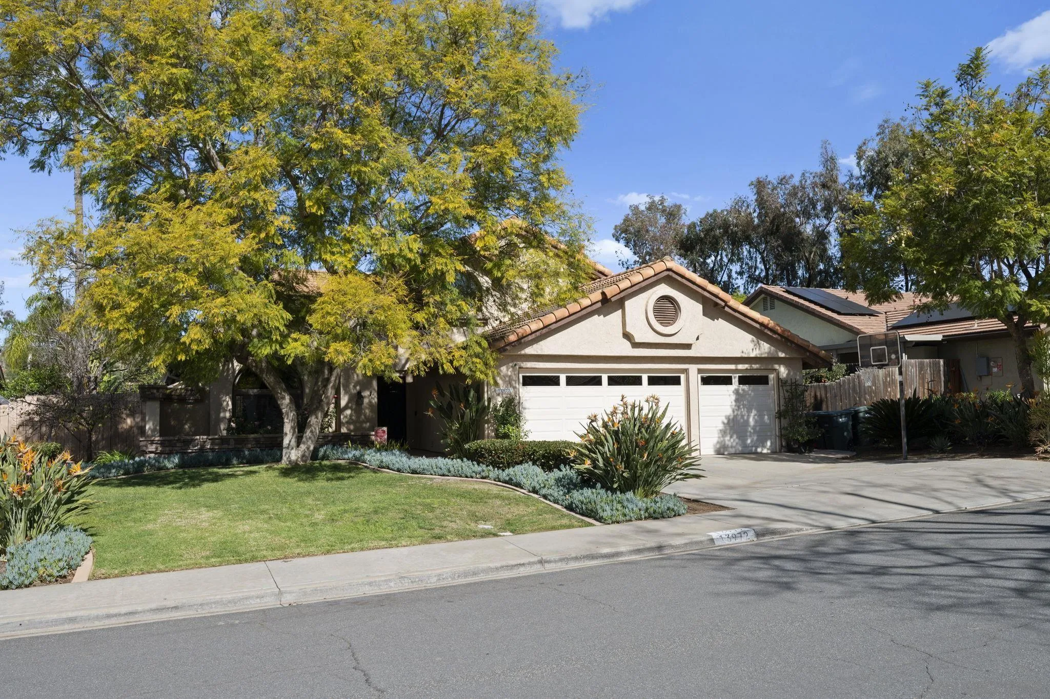 13972 Poway Valley Road Poway, CA 92064 - Photo 3 of 59 a front view of a house with a yard garage and outdoor seating