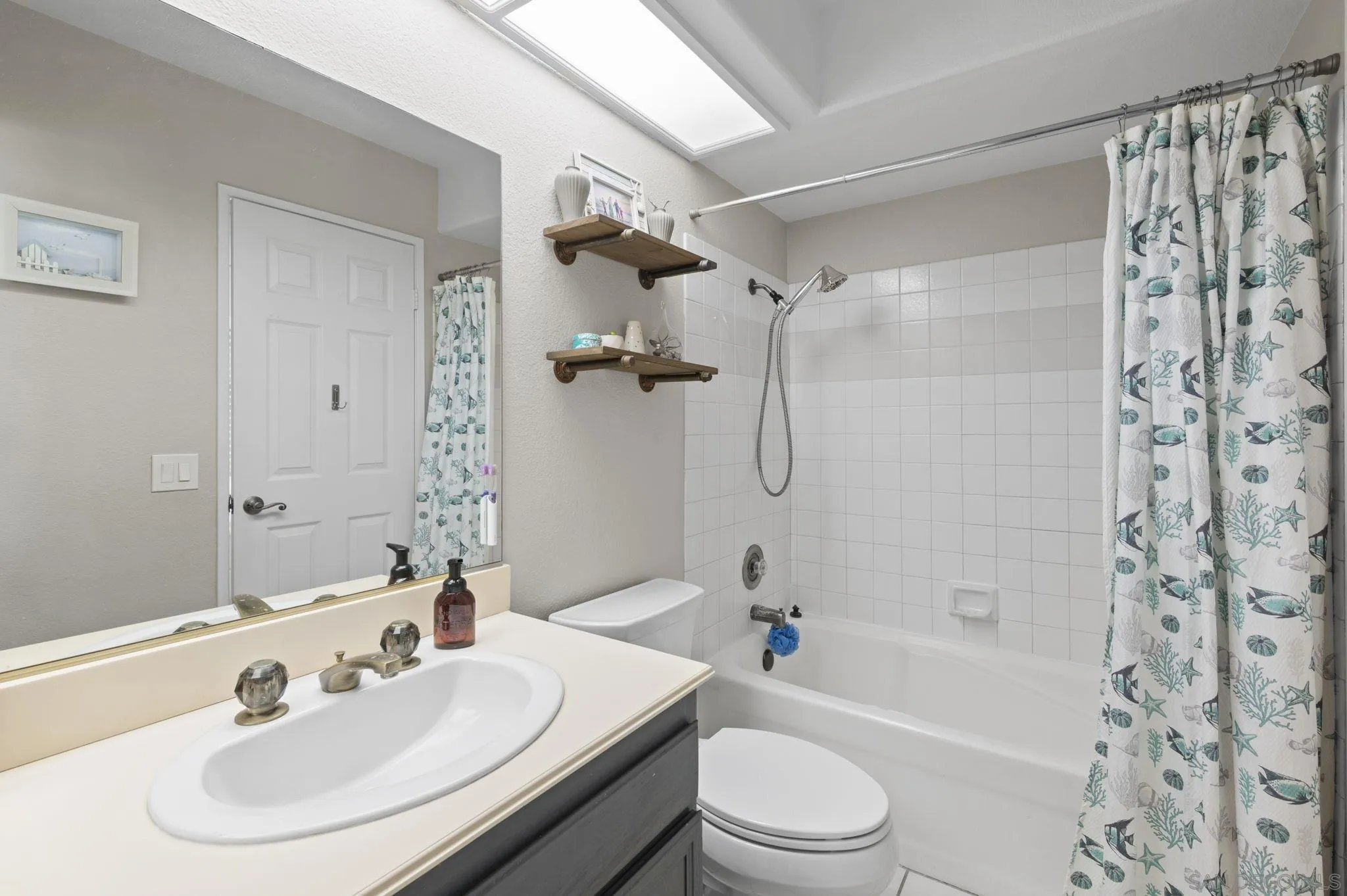 13972 Poway Valley Road Poway, CA 92064 - Photo 31 of 59 a bathroom with a sink toilet and shower