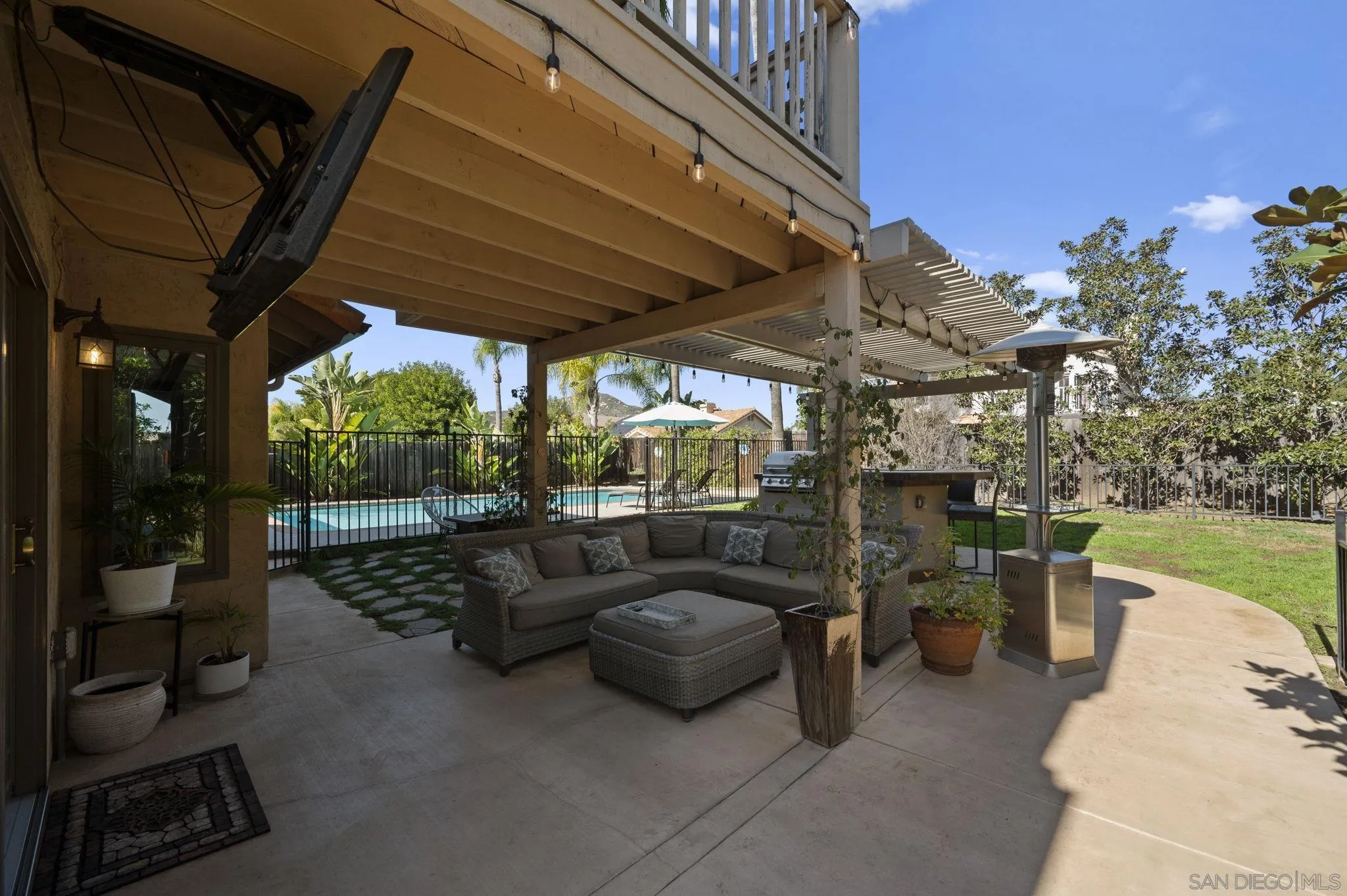 13972 Poway Valley Road Poway, CA 92064 - Photo 35 of 59 a view of a patio with couches table and chairs and potted plants