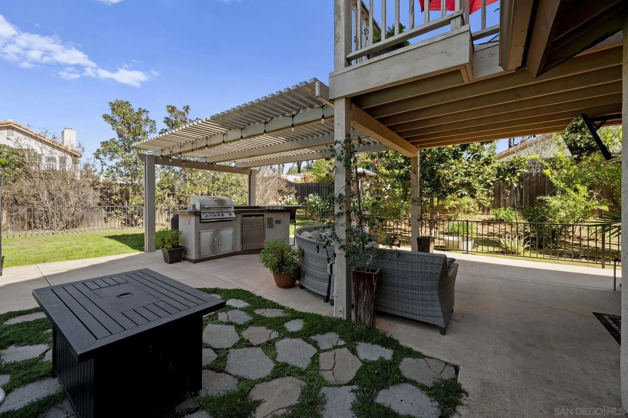 13972 Poway Valley Road Poway, CA 92064 - Photo 37 of 59 a view of a patio with table and chairs and potted plants
