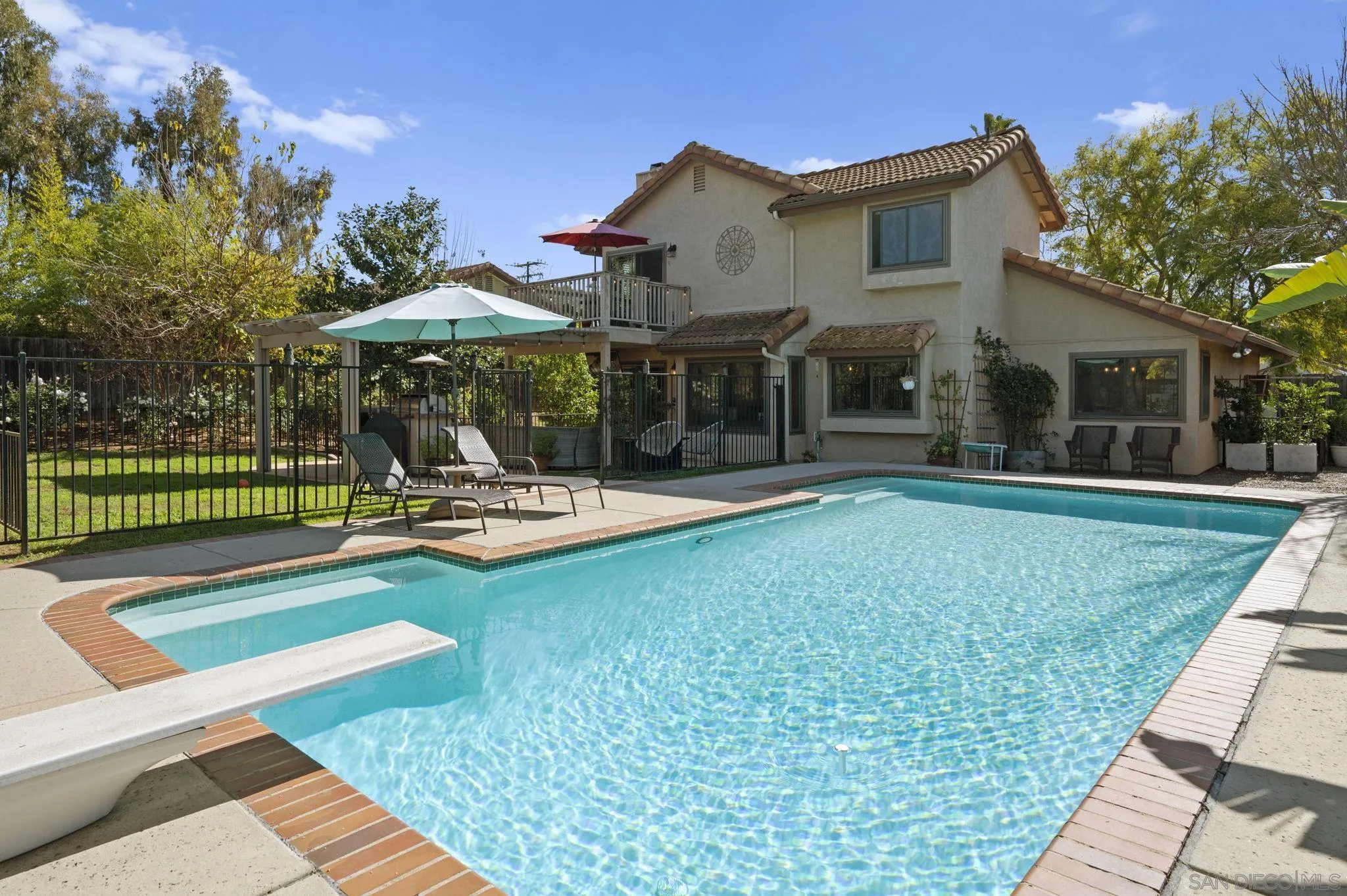 13972 Poway Valley Road Poway, CA 92064 - Photo 43 of 59 a swimming pool with outdoor seating and yard