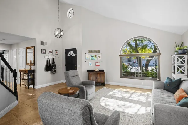 a living room with furniture and a window