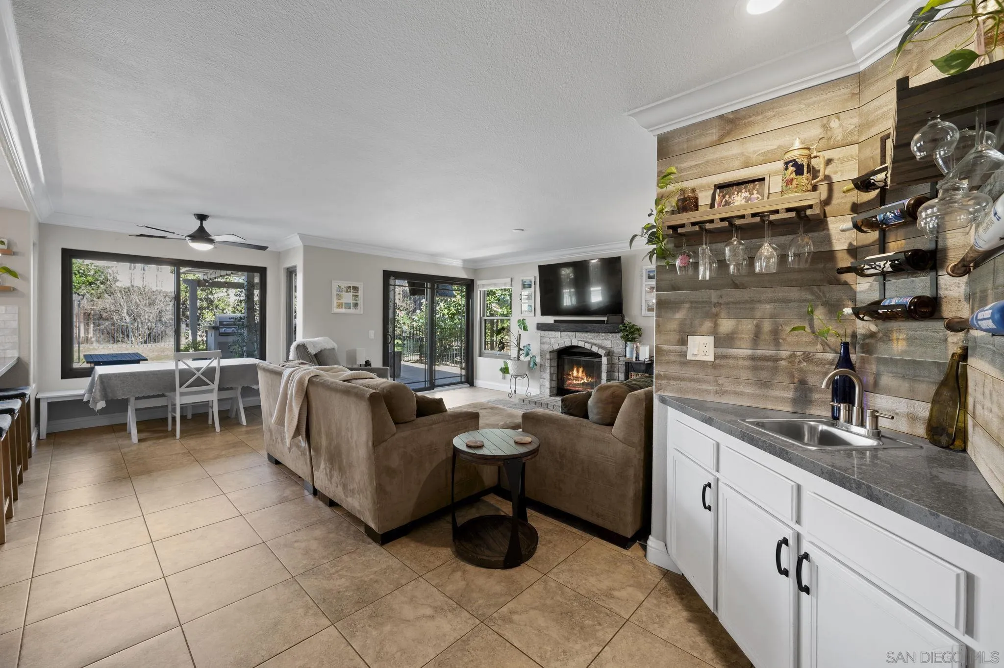 13972 Poway Valley Road Poway, CA 92064 - Photo 9 of 59 a living room with furniture a rug and a fireplace
