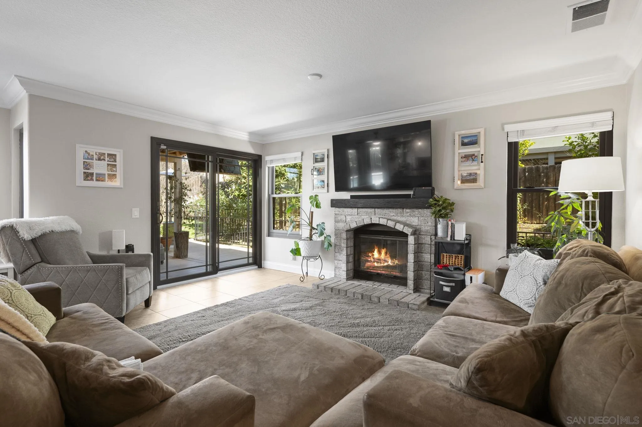 13972 Poway Valley Road Poway, CA 92064 - Photo 10 of 59 a living room with furniture a flat screen tv and a fireplace
