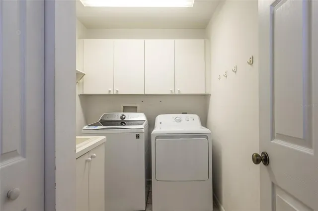 a utility room with dryer and washer