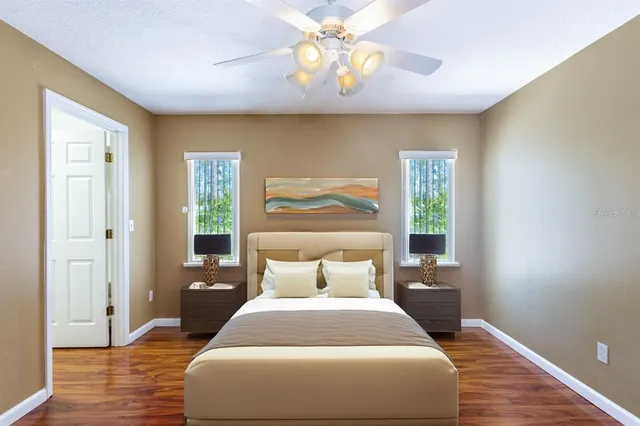 a bedroom with a bed and a window