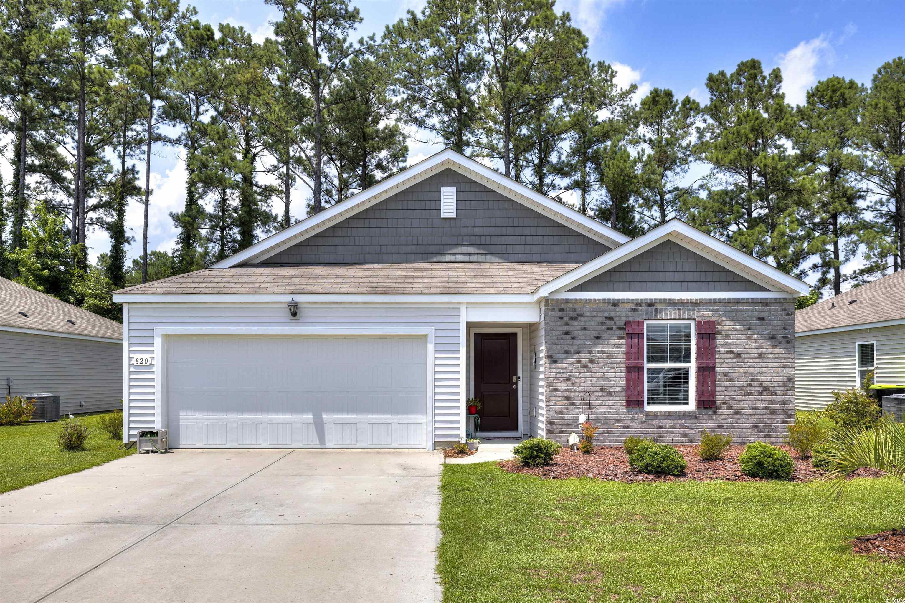 820 Twickenham Loop Longs, SC 29568 - Photo 1 of 38 View of front of home with a garage, central AC, a