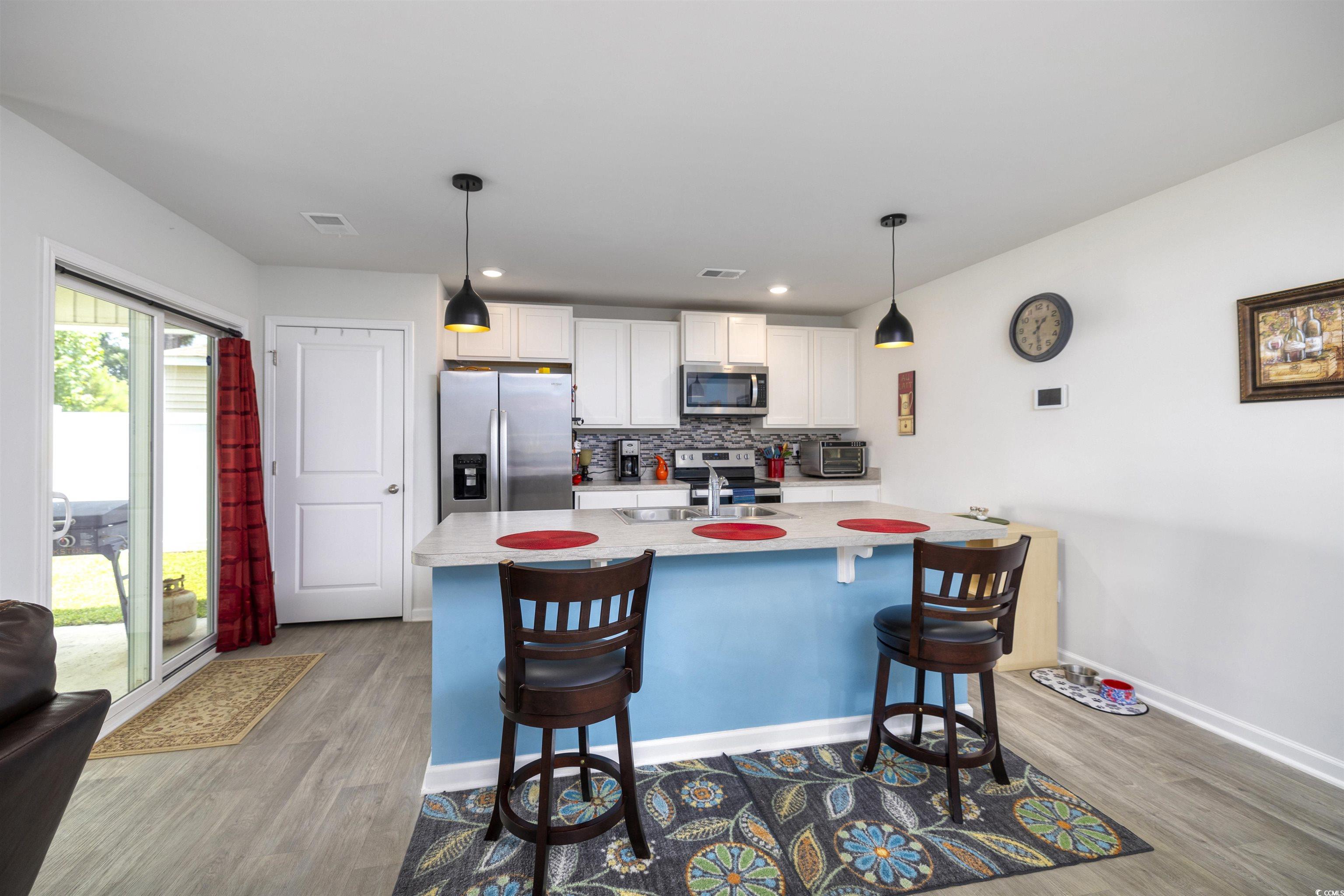 820 Twickenham Loop Longs, SC 29568 - Photo 12 of 38 Kitchen with white cabinets, stainless steel appli