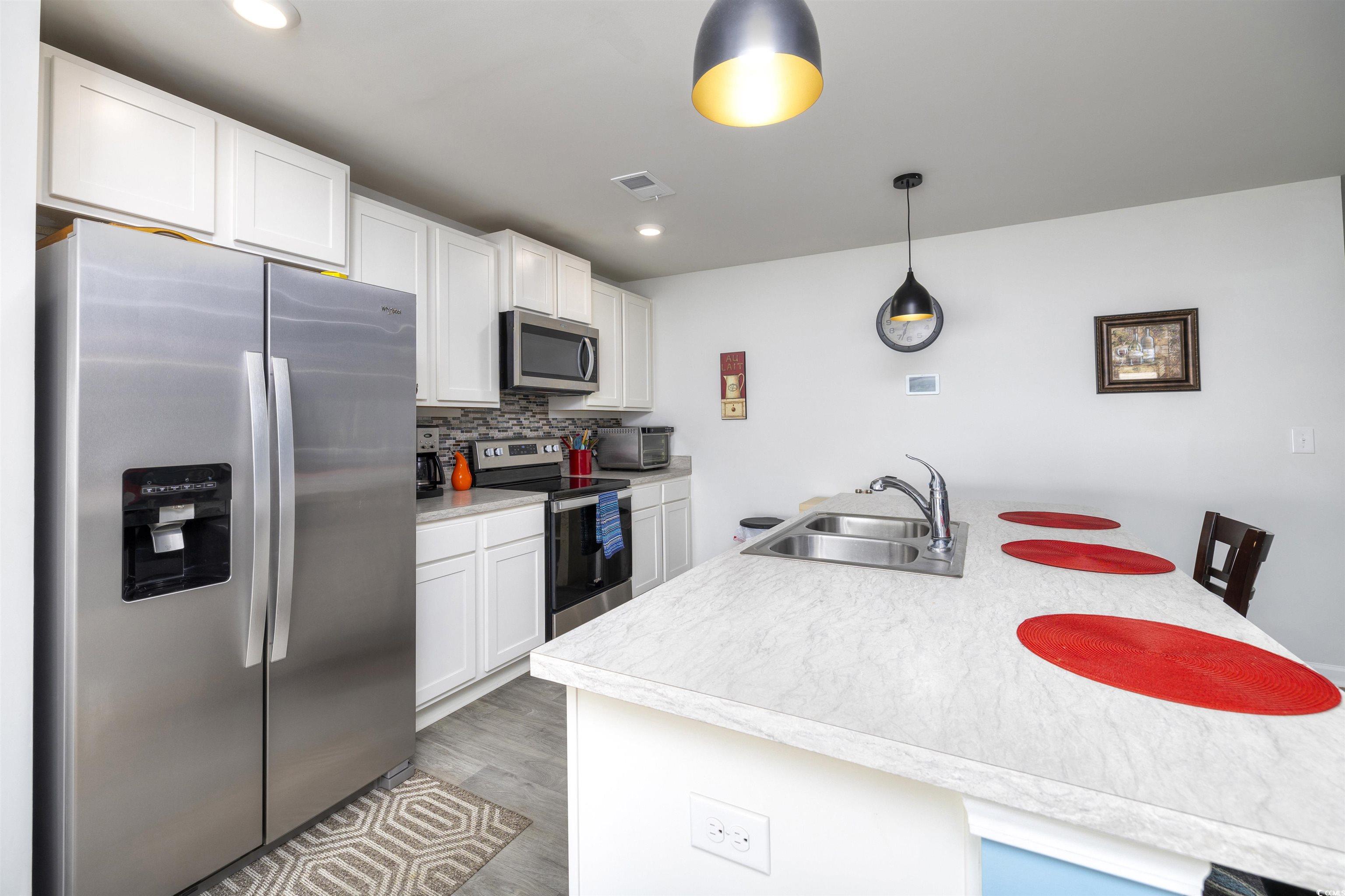 820 Twickenham Loop Longs, SC 29568 - Photo 16 of 38 Kitchen with stainless steel appliances, sink, bac