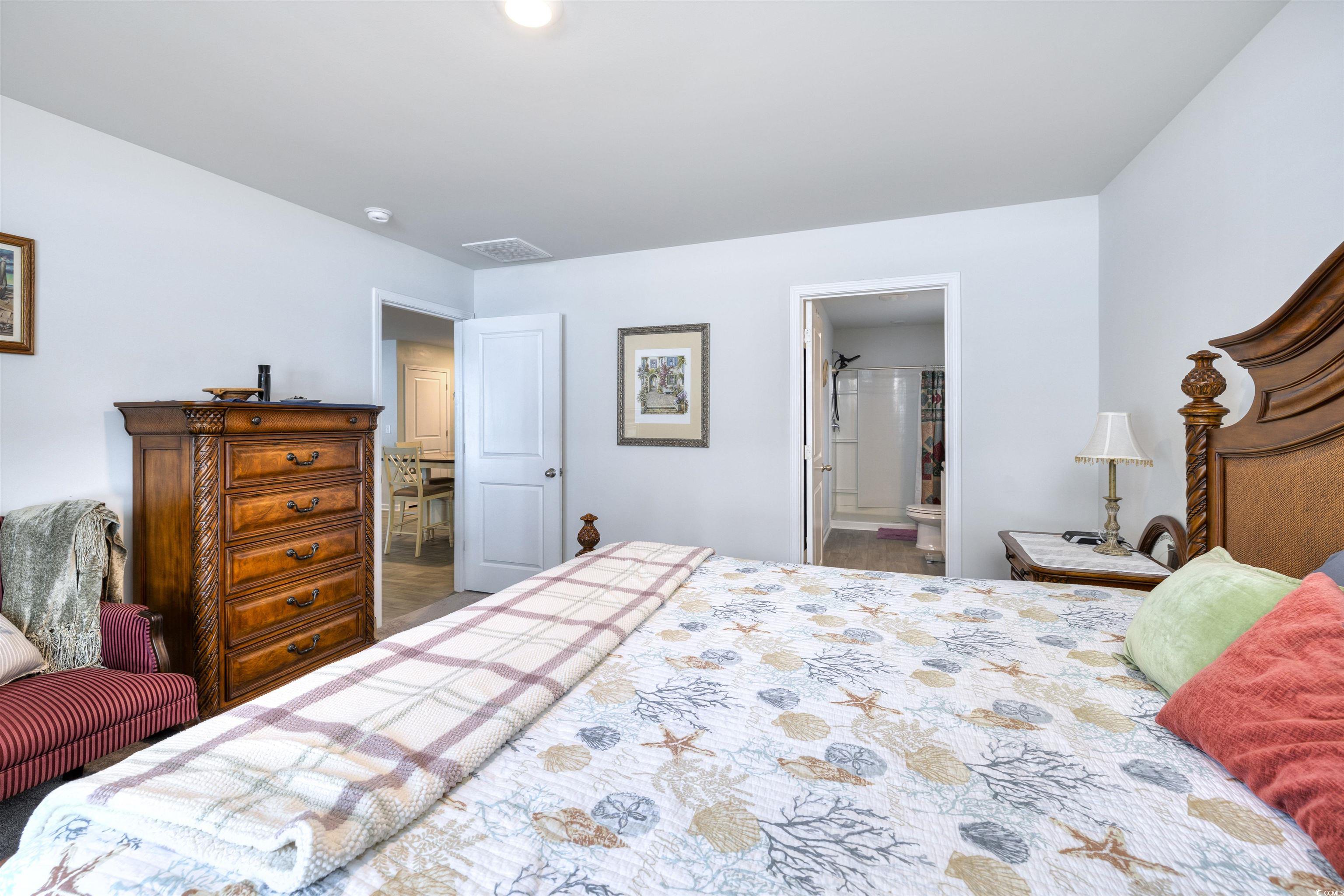 820 Twickenham Loop Longs, SC 29568 - Photo 19 of 38 Bedroom with tile patterned floors and ensuite bat