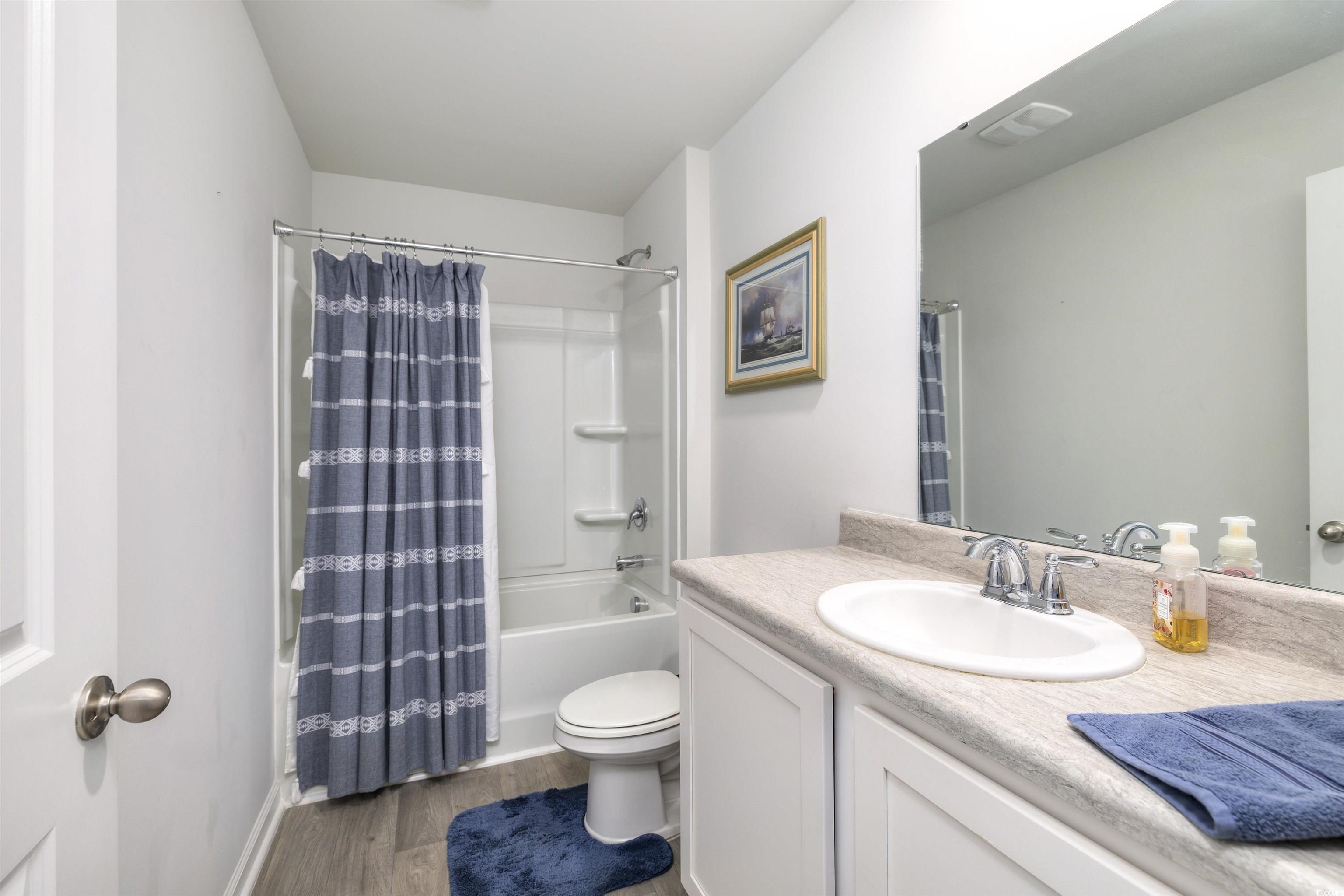 820 Twickenham Loop Longs, SC 29568 - Photo 27 of 38 Full bathroom with wood-type flooring, toilet, van