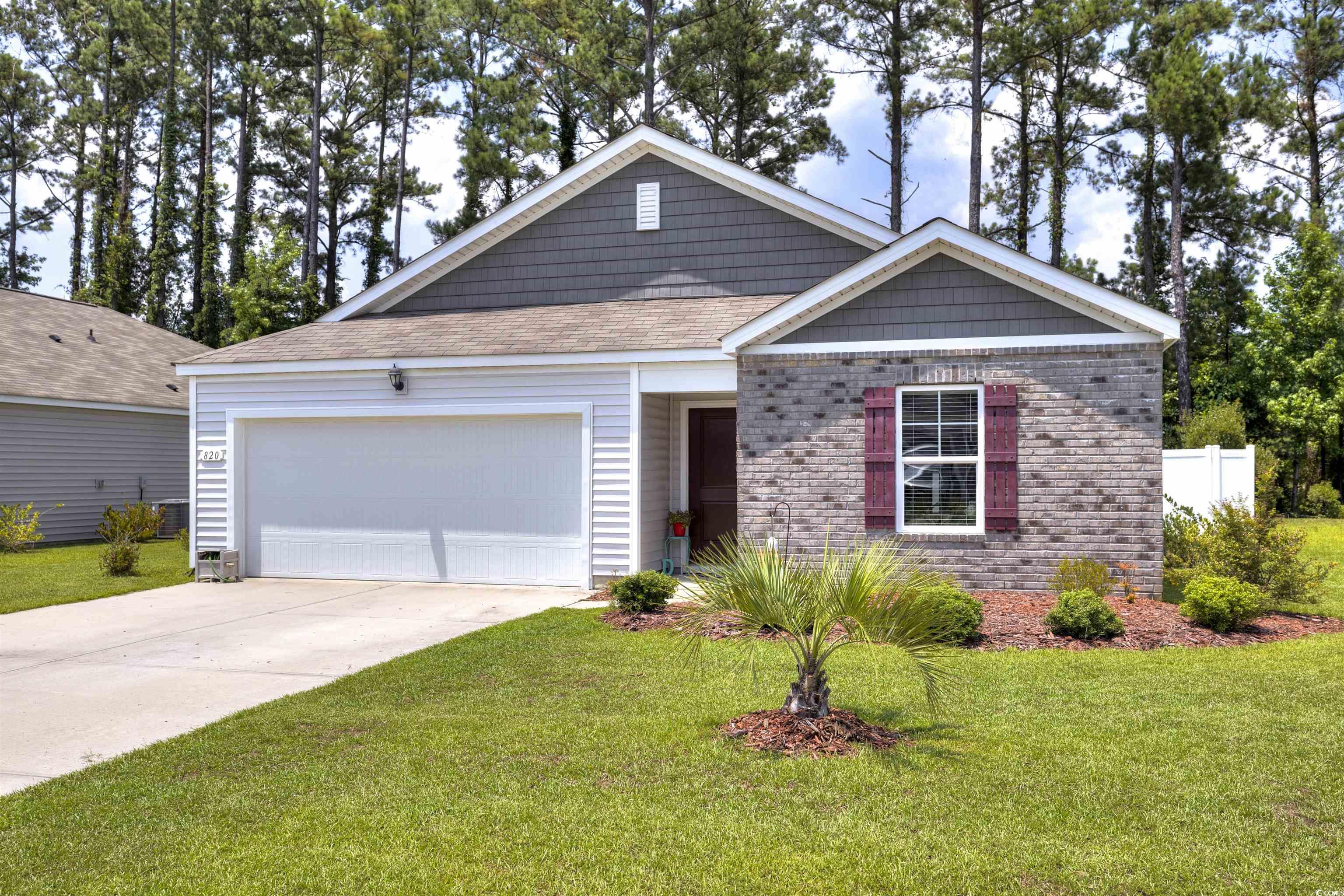 820 Twickenham Loop Longs, SC 29568 - Photo 37 of 38 View of front facade featuring a garage and a fron