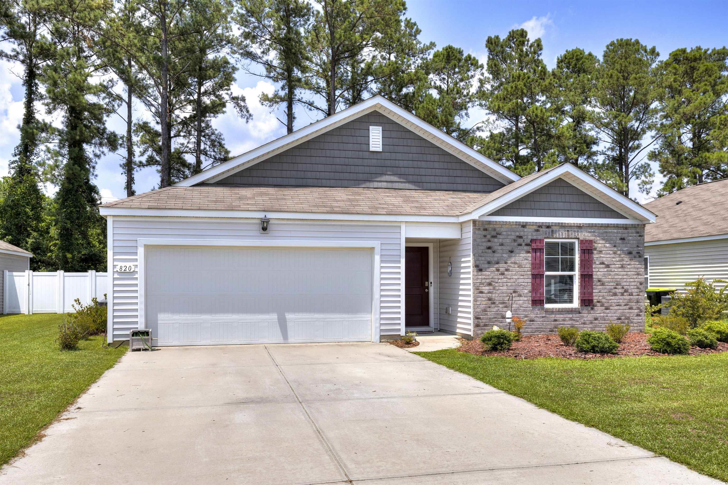 820 Twickenham Loop Longs, SC 29568 - Photo 38 of 38 View of front facade featuring a garage and a fron