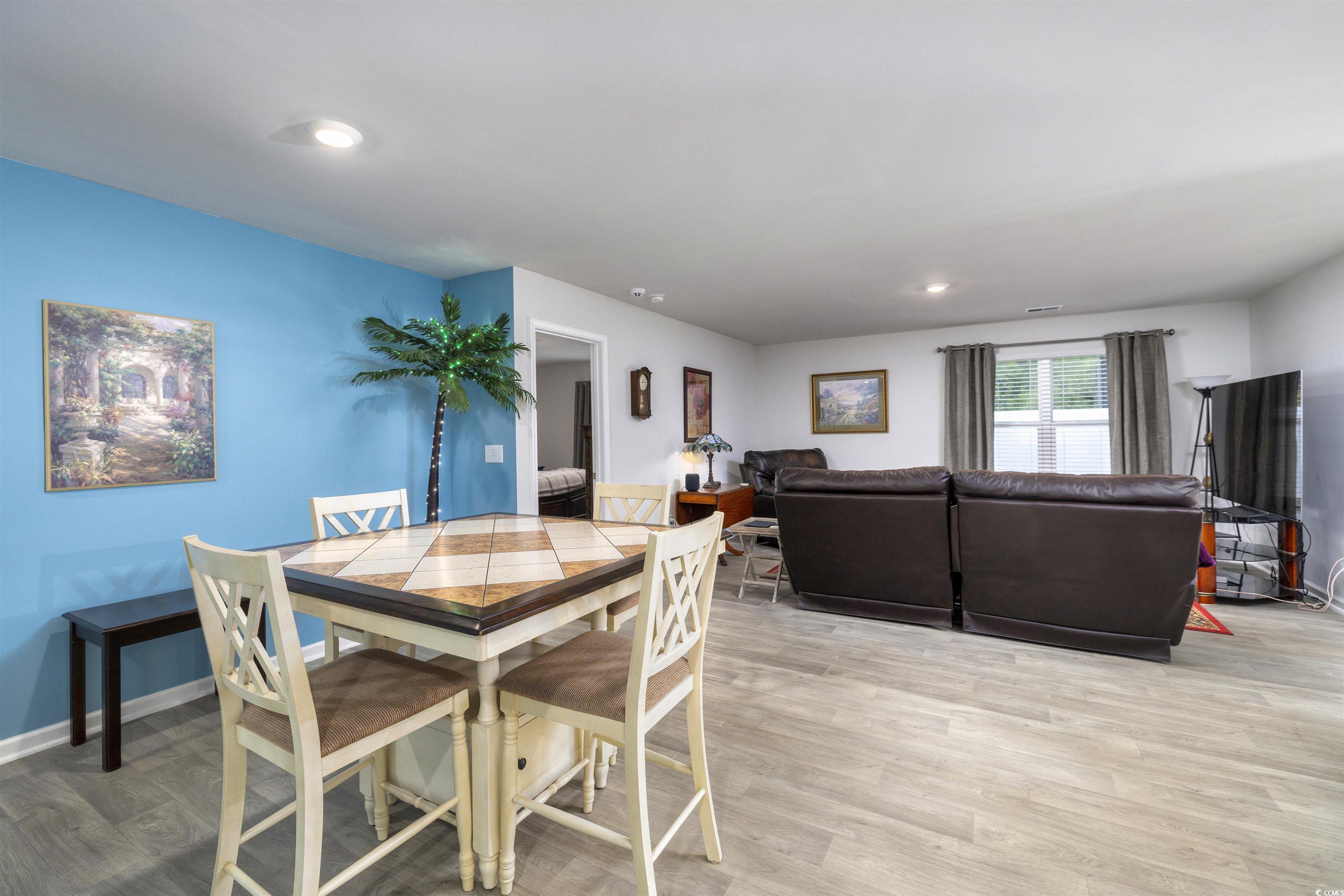 820 Twickenham Loop Longs, SC 29568 - Photo 4 of 38 Dining room featuring wood-type flooring