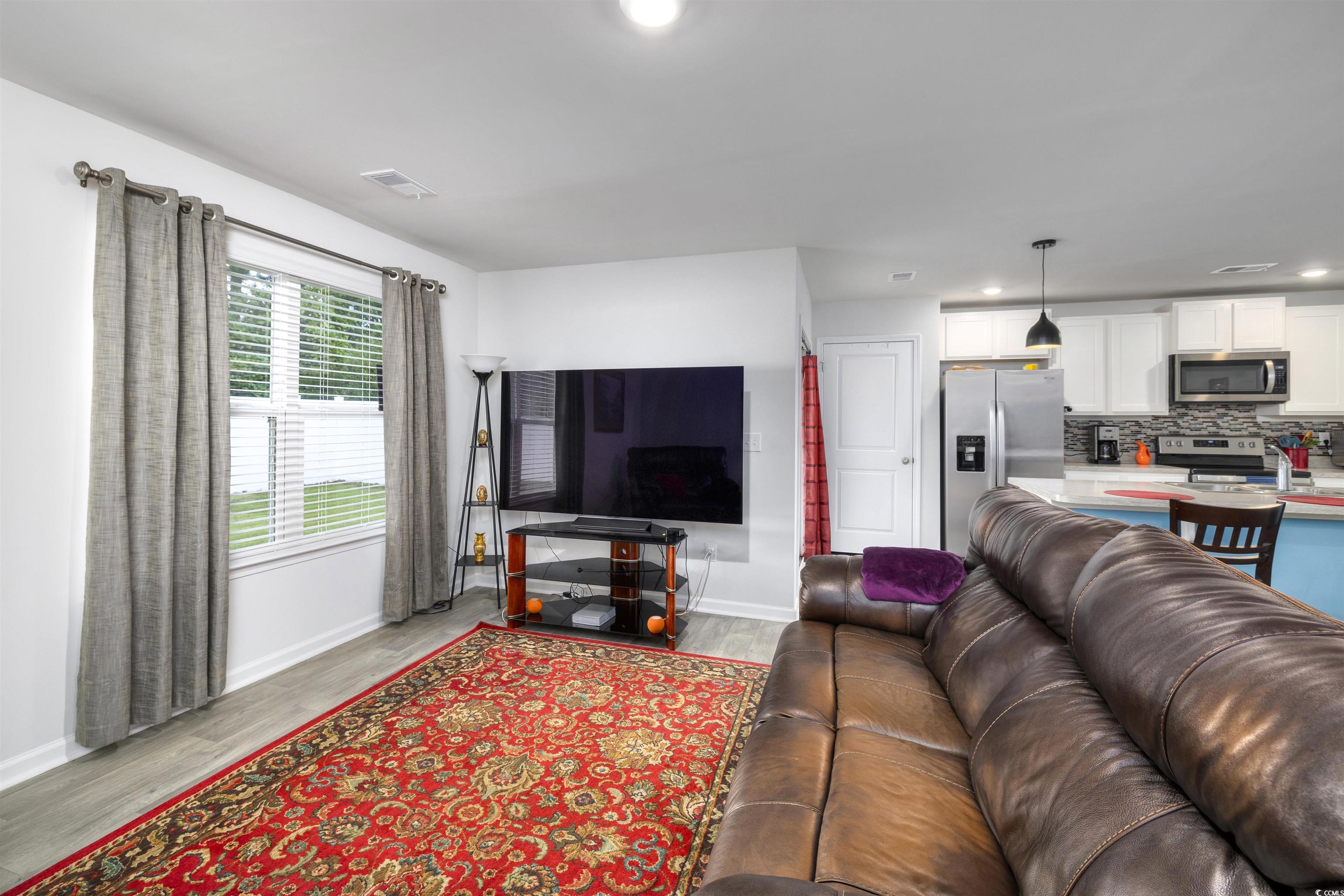 820 Twickenham Loop Longs, SC 29568 - Photo 9 of 38 Living room featuring hardwood / wood-style floori