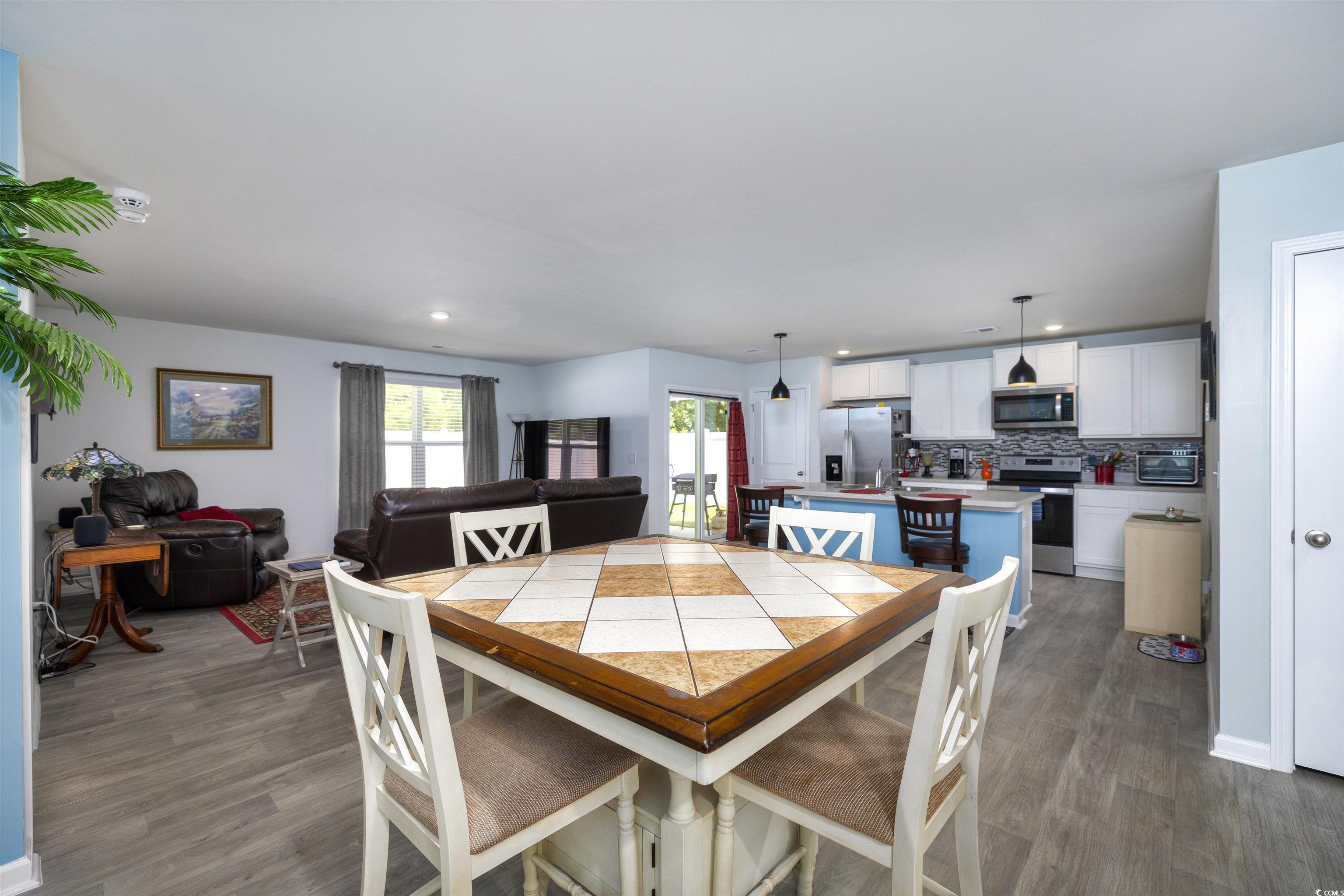 820 Twickenham Loop Longs, SC 29568 - Photo 10 of 38 Dining area featuring dark hardwood / wood-style f