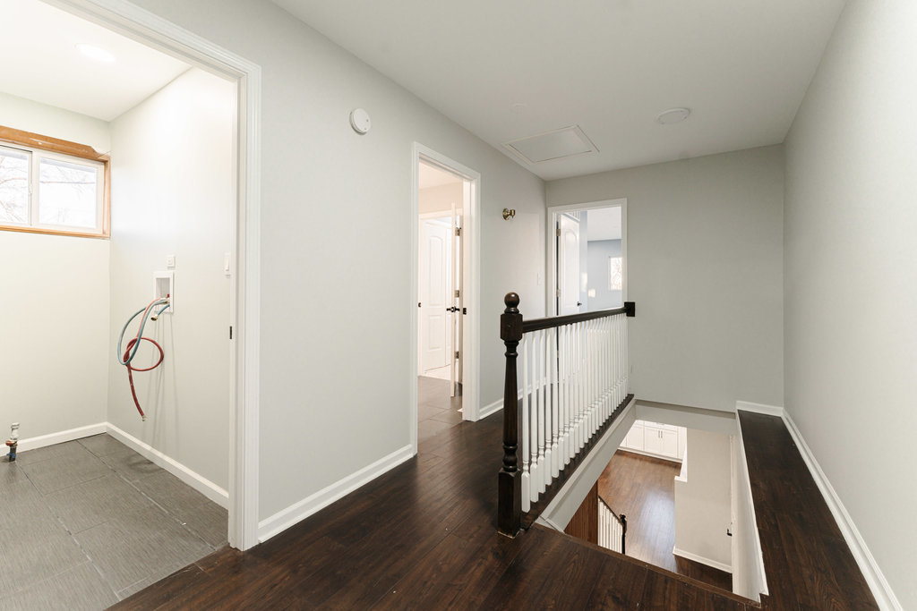 4841 West 119th Street Alsip, IL 60803 - Photo 15 of 33 a view of a hallway with wooden floor and staircase