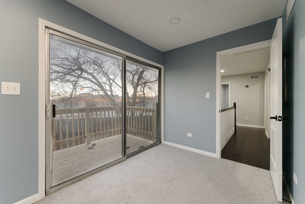 4841 West 119th Street Alsip, IL 60803 - Photo 18 of 33 a view of a room with sliding glass door and balcony