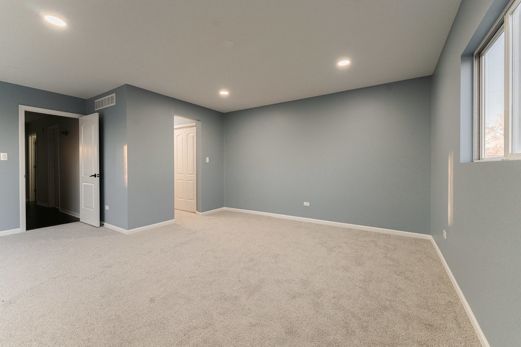 4841 West 119th Street Alsip, IL 60803 - Photo 19 of 33 a view of an empty room with a window