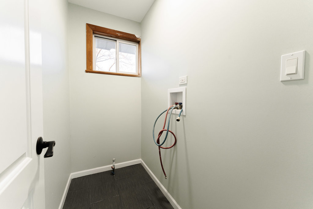 4841 West 119th Street Alsip, IL 60803 - Photo 22 of 33 a view of a room with rack on the wall and a window